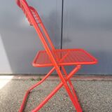 Vintage red metal folding chair