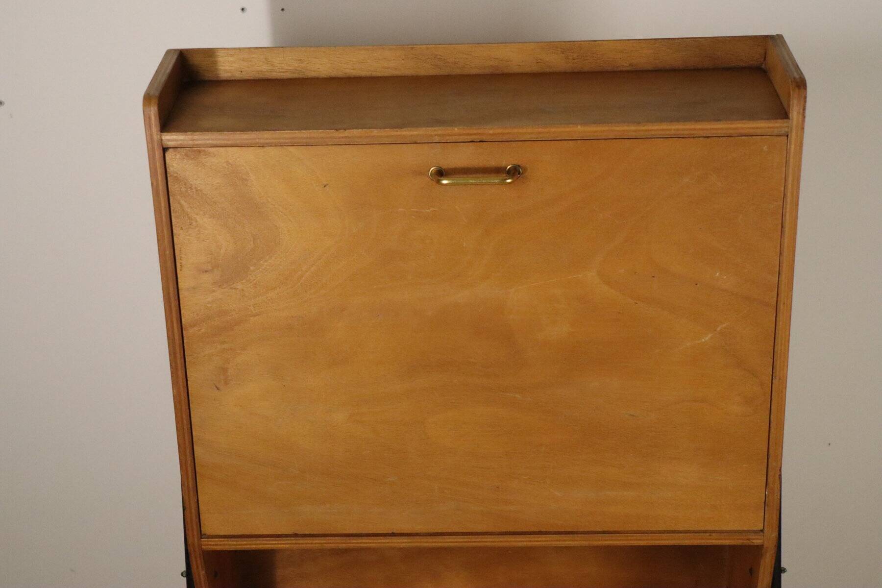 Vintage 1960s wooden secretary with metal legs.