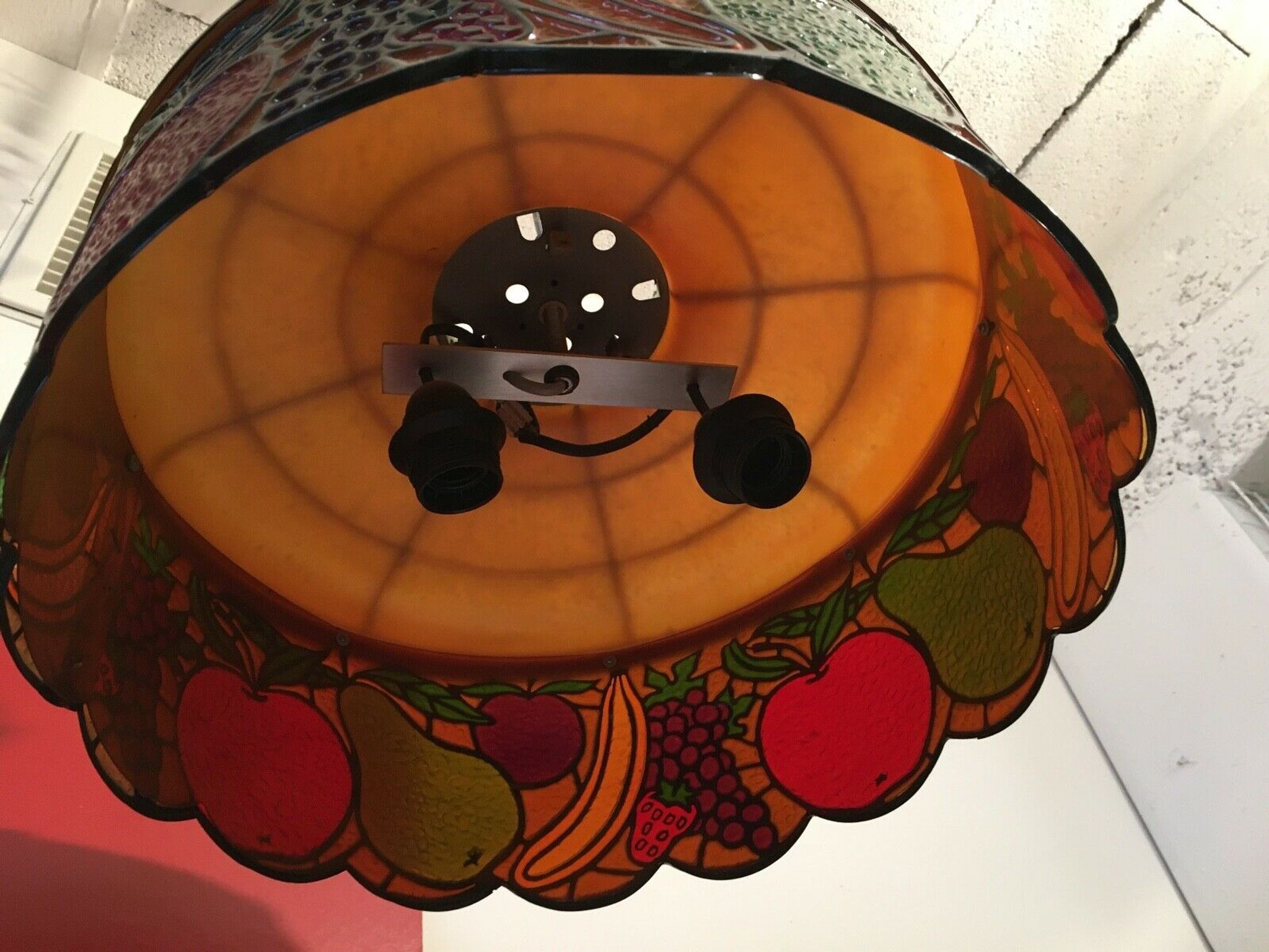 Vintage light suspension in composite fruit decoration
