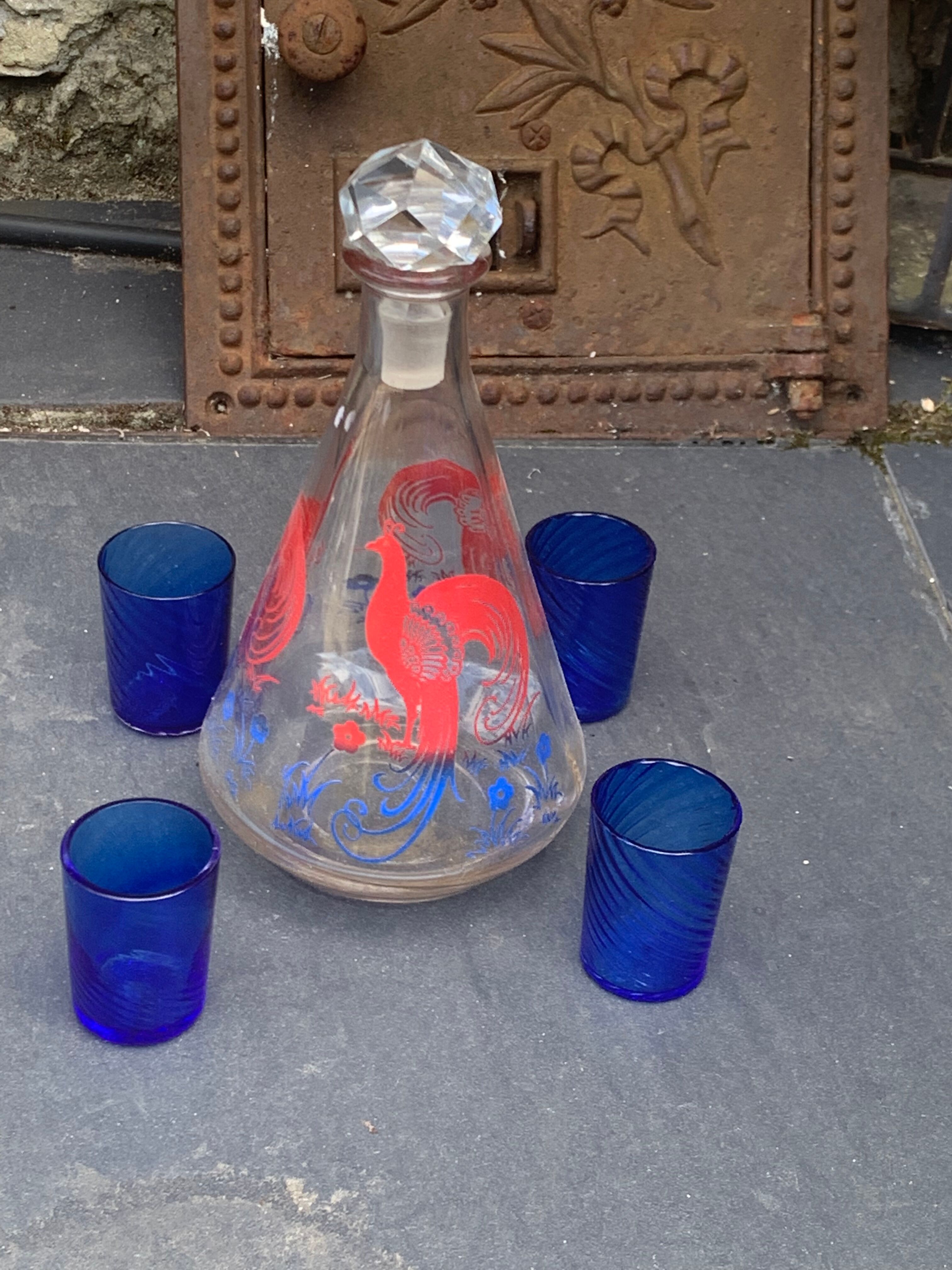 Peacock pattern liqueur decanter and 4 small vintage cobalt blue glasses