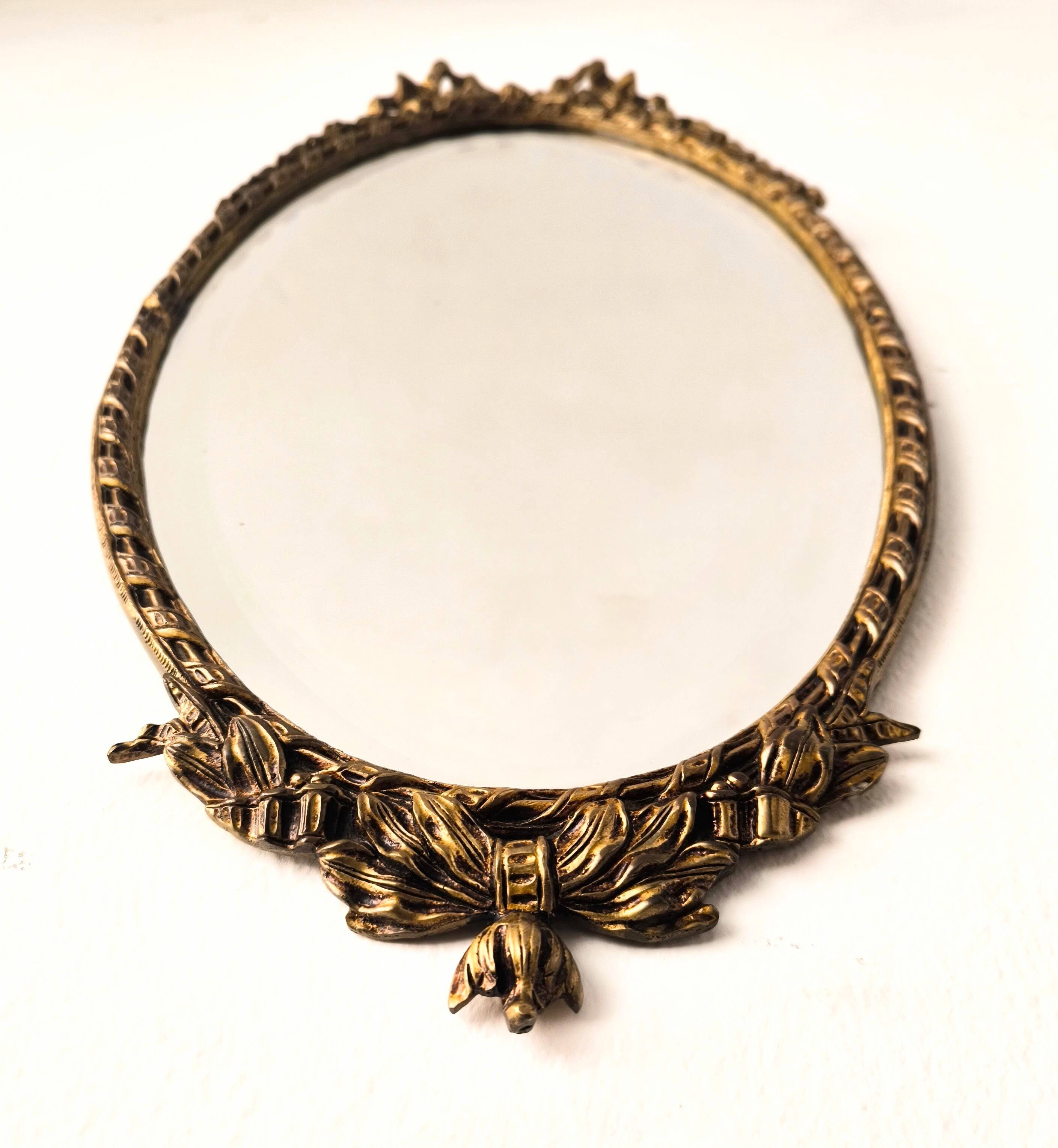 Bronze mirror in Hollywood Regency style from the 1940s/50s.