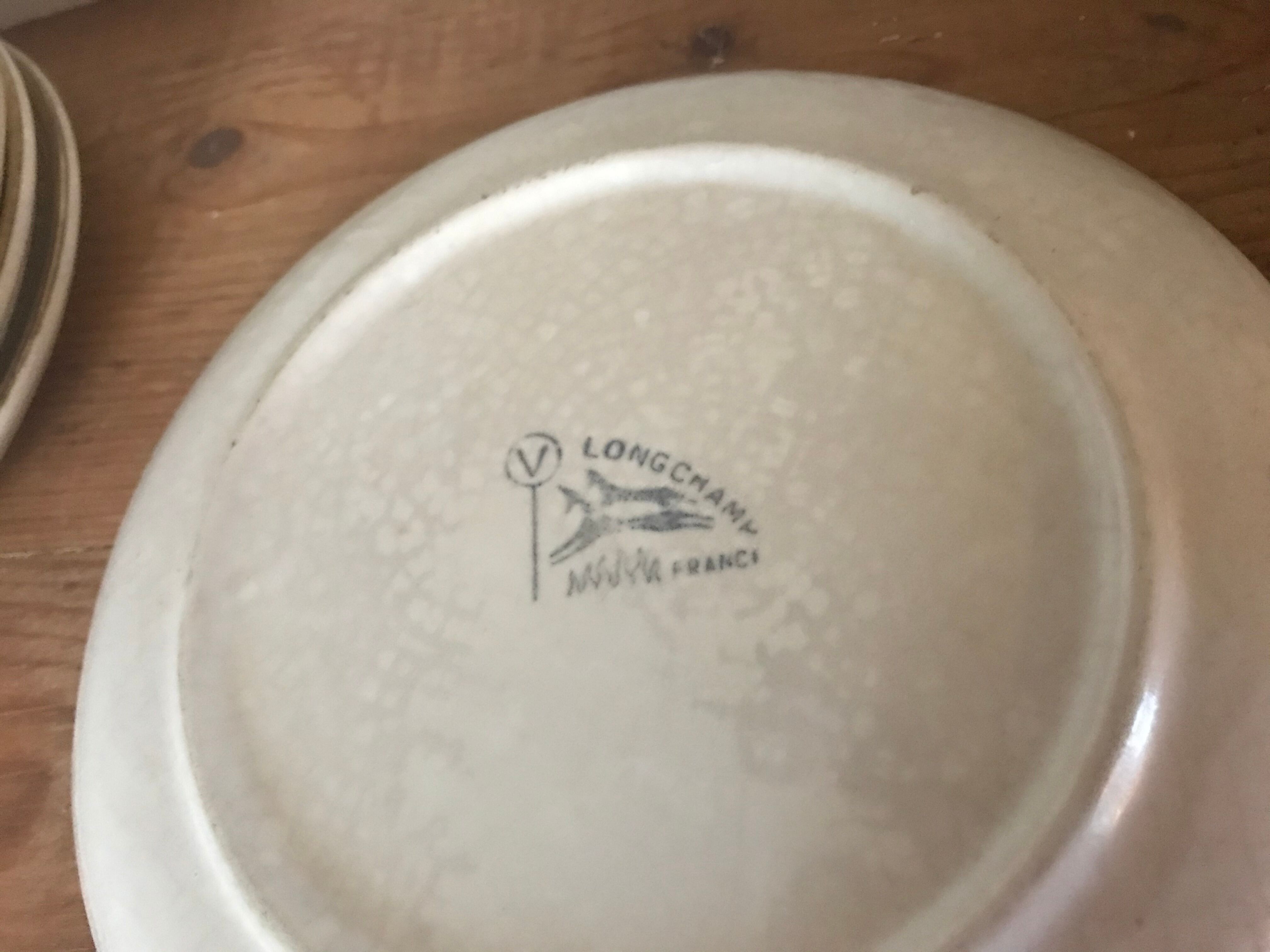 Six sandstone dessert plates by Longchamp