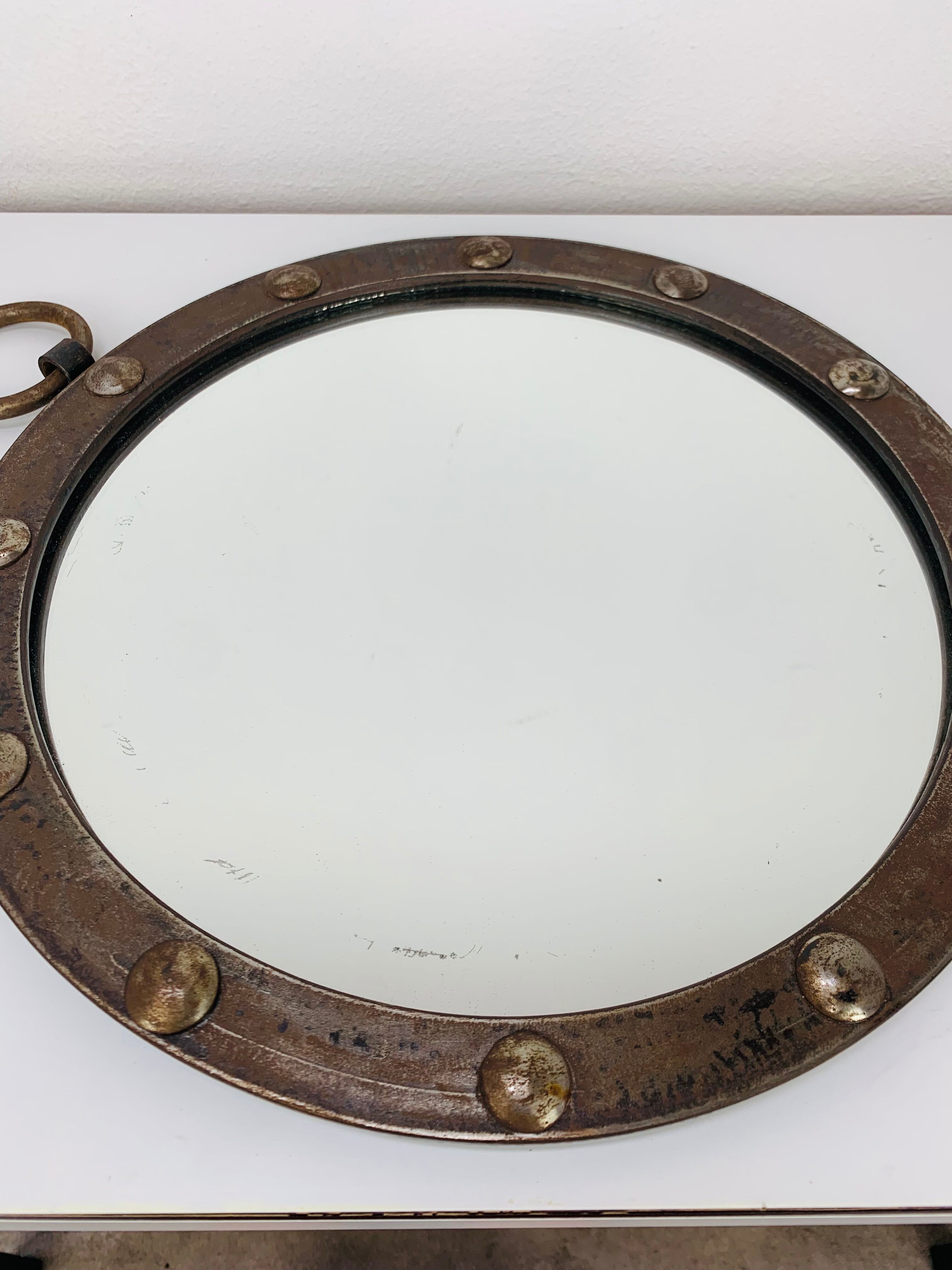 Round wrought iron porthole mirror