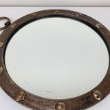 Round wrought iron porthole mirror