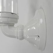 Wall lamp in porcelain with a transparent glass shade, 1930s.