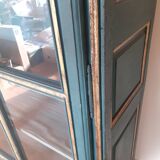 Glass cabinet in green patinated wood