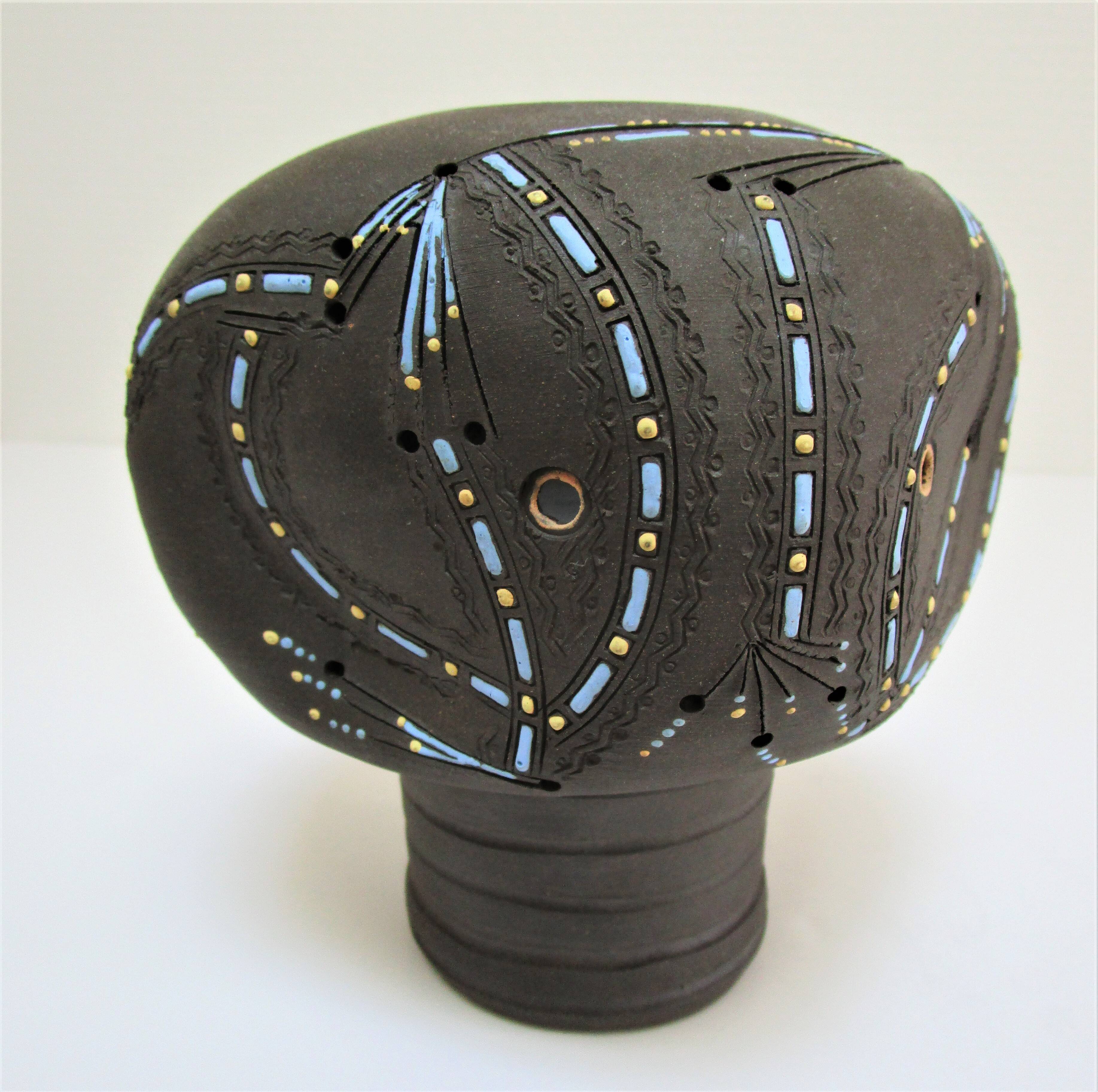 Anthropomorphic candle holder, scarified ceramic, stamped design