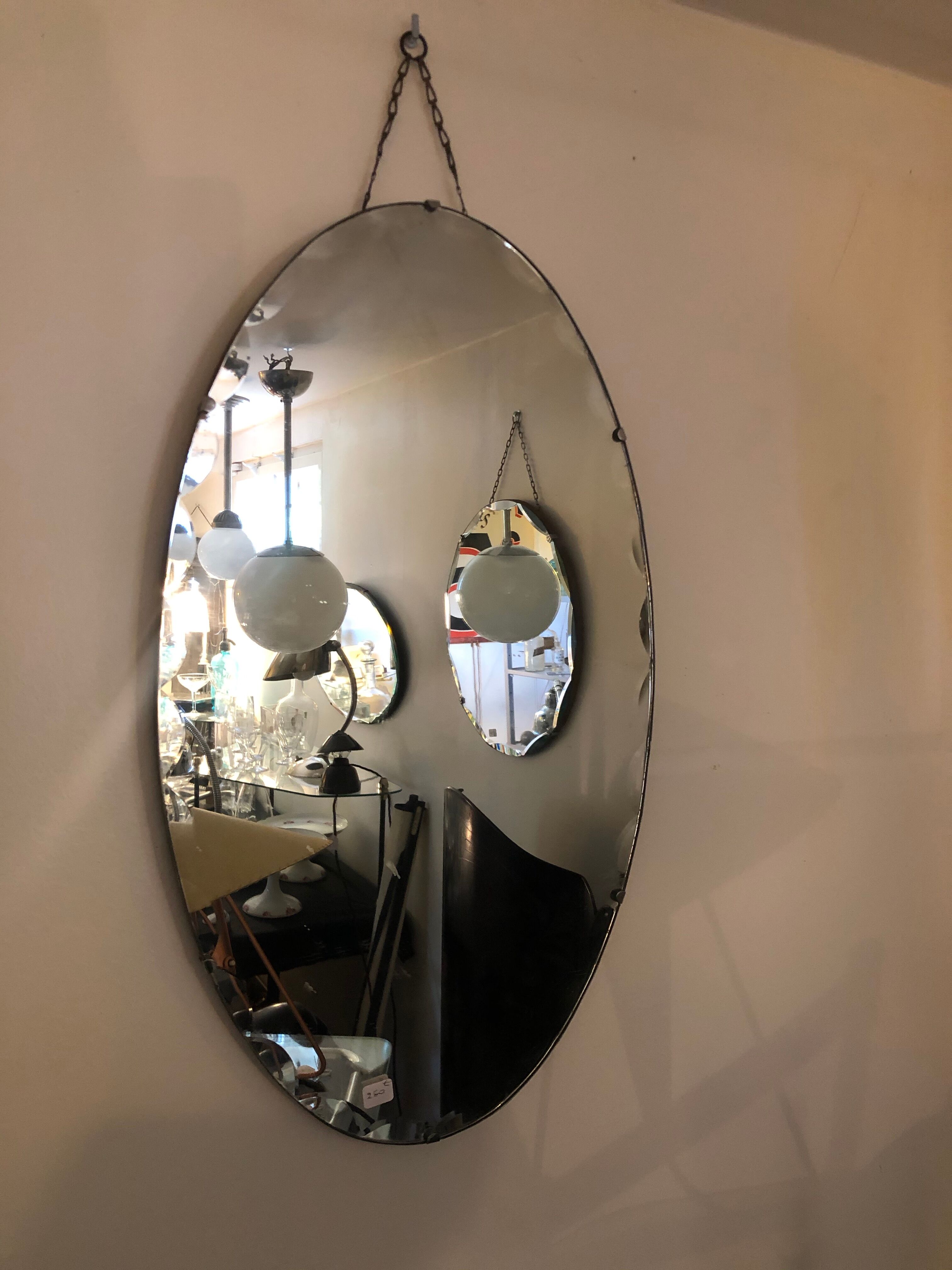 Bevelled art deco oval mirror mounted on wood with vertical or horizontal original chain 38x68cm