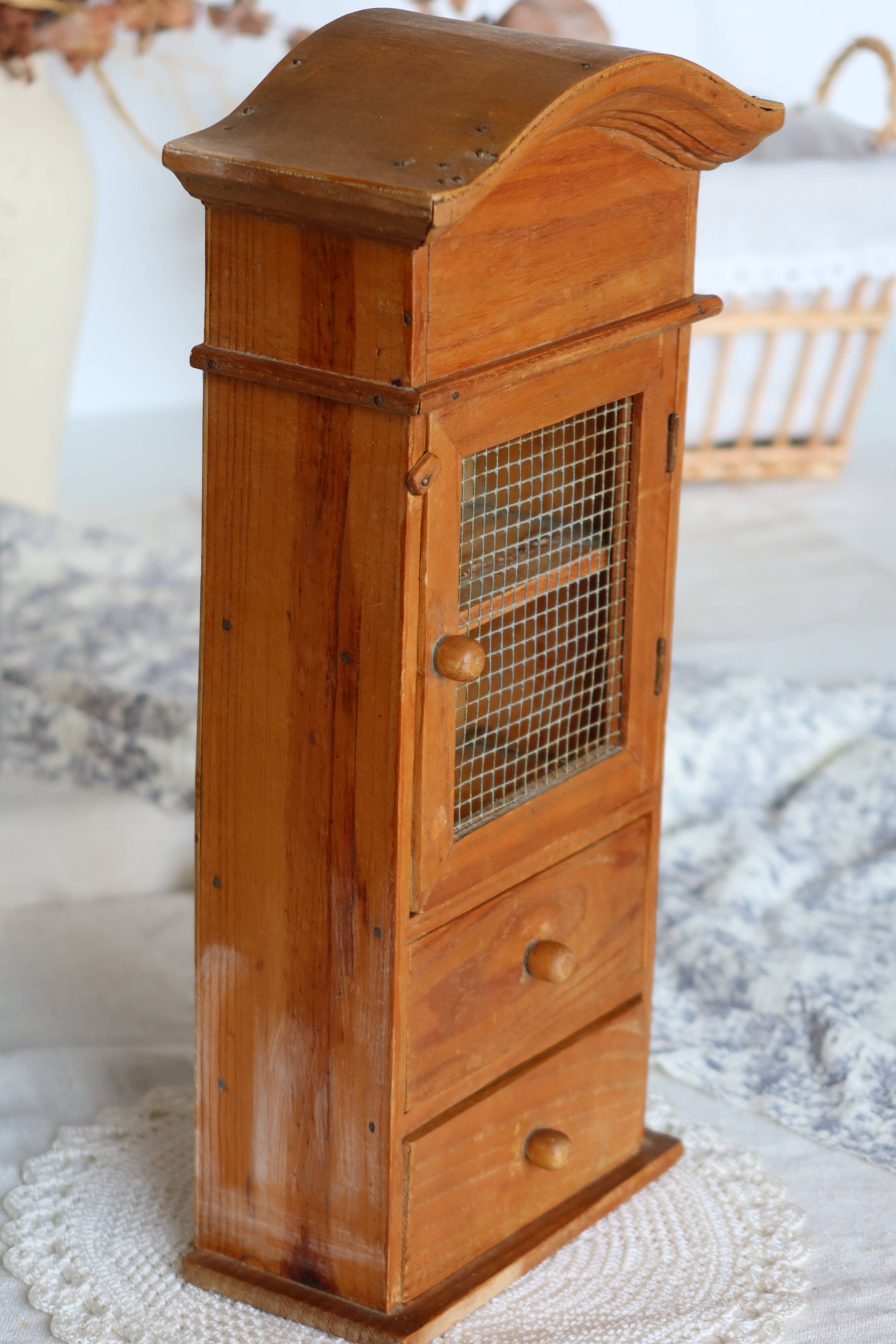 Vintage wooden shelf with drawers and wire mesh door