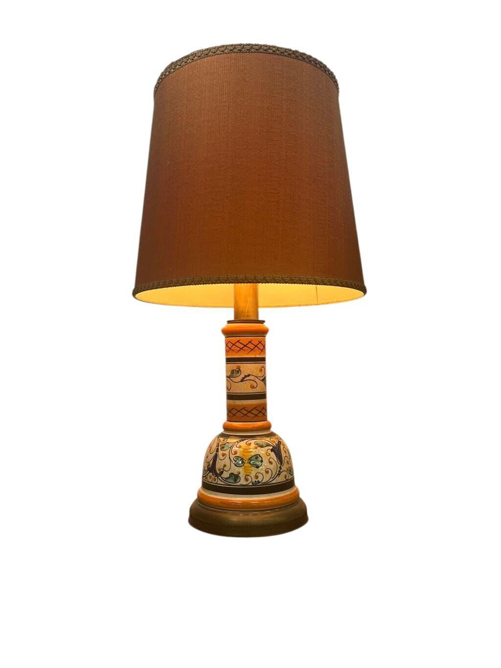 Vintage orange Portuguese table lamp with a ceramic base.