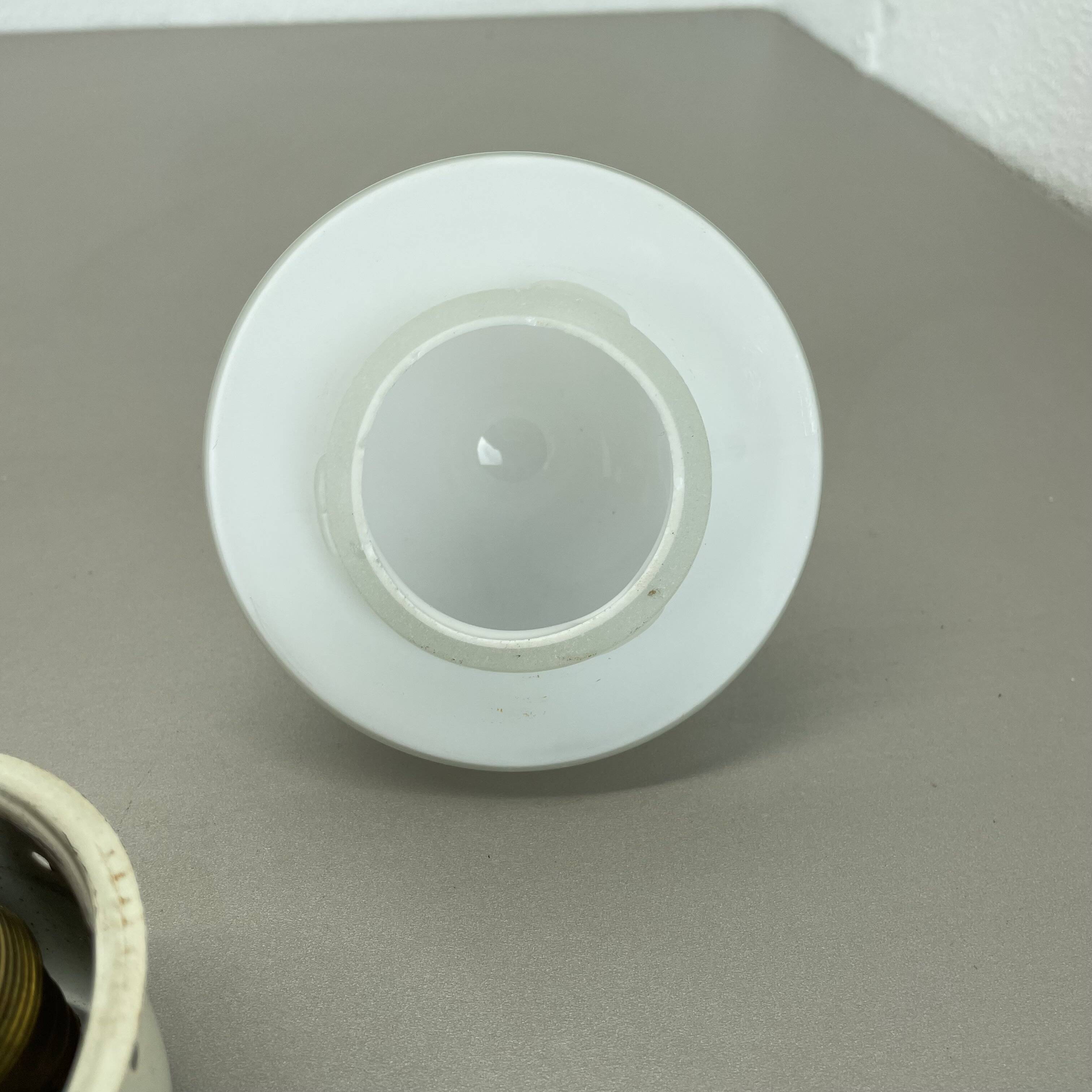 Round red wall light in metal and opaline glass in the Stilnovo style, 20 cm, Italy, 1960s