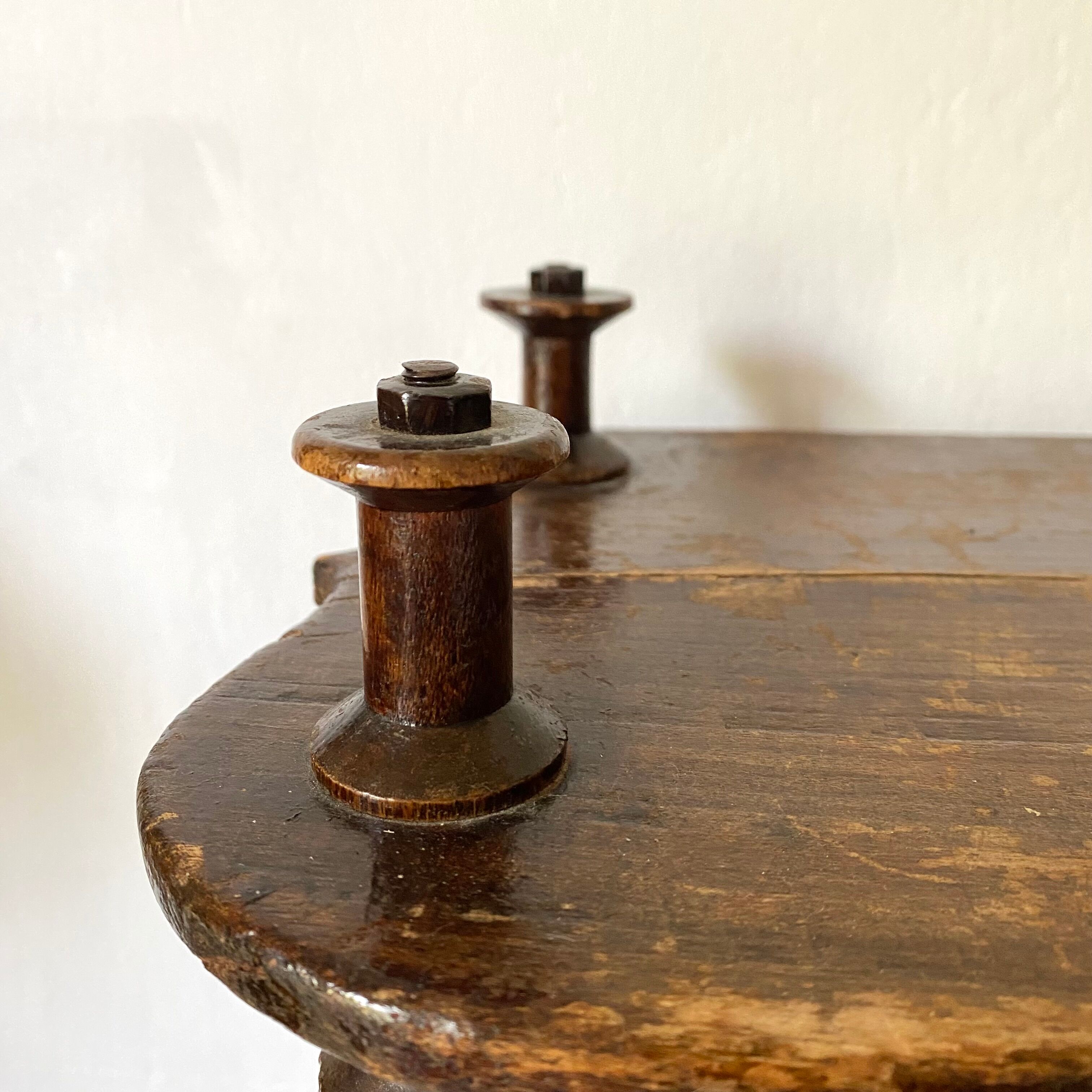 Old shelf in turned wood like reels