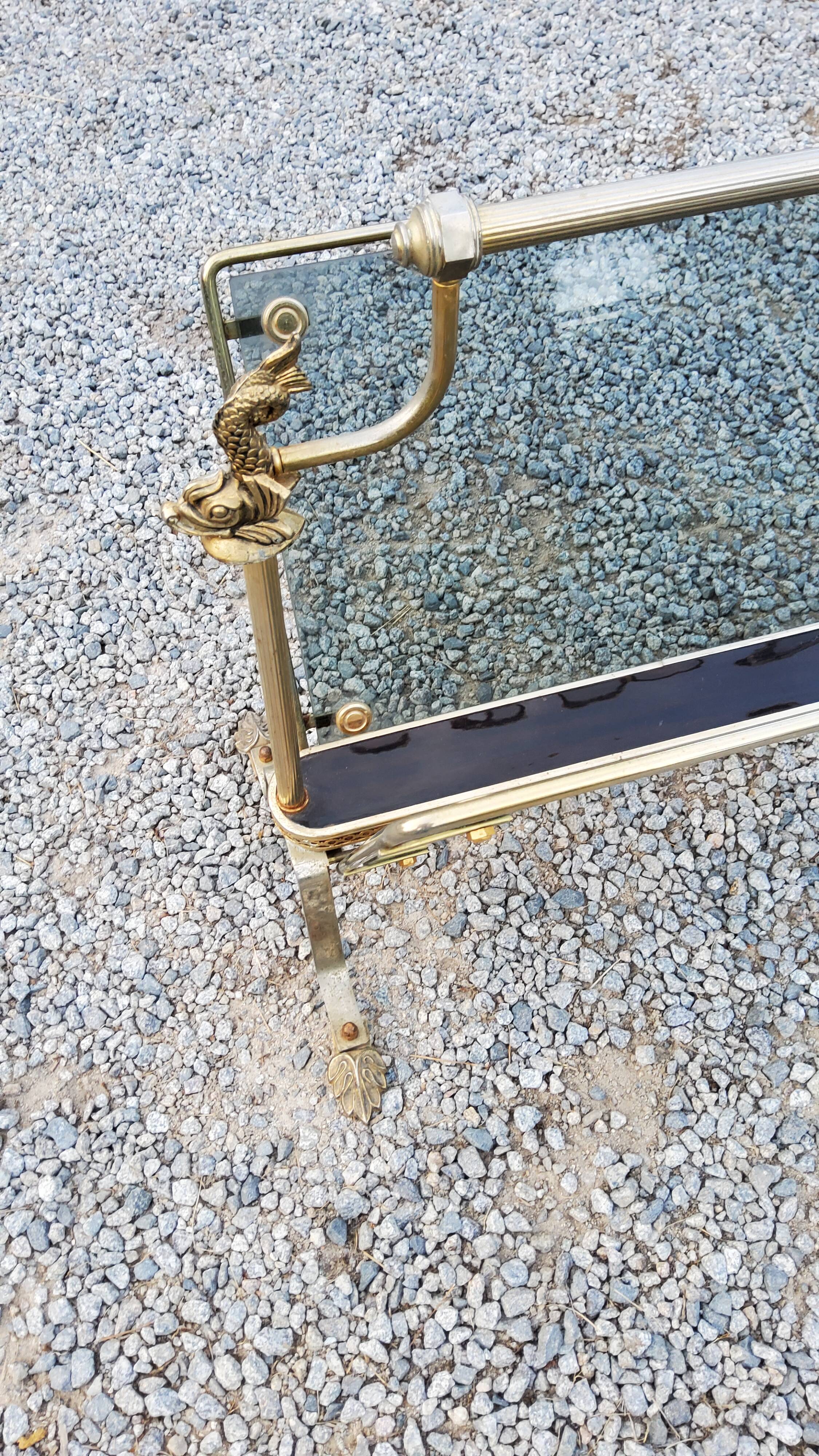 Porte revue des années 50 en métal doré aux dauphins et verres fumés