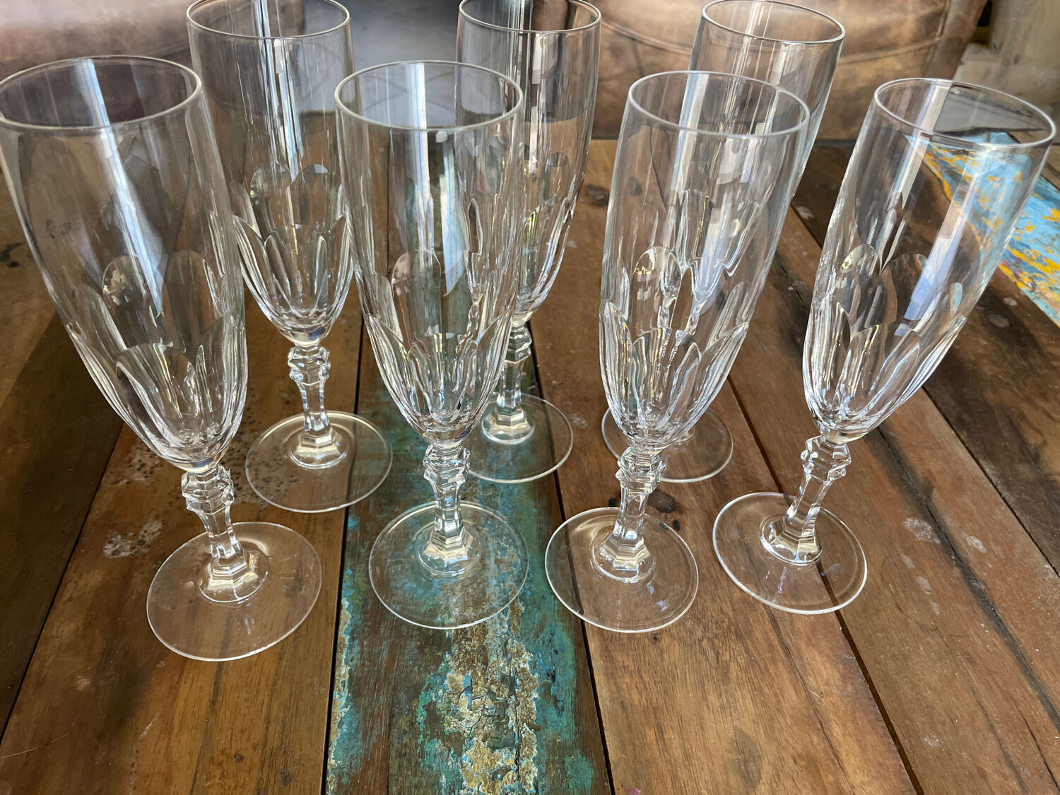 Set of 7 champagne flutes. Made of cut crystal.