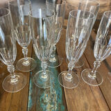 Set of 7 champagne flutes. Made of cut crystal.