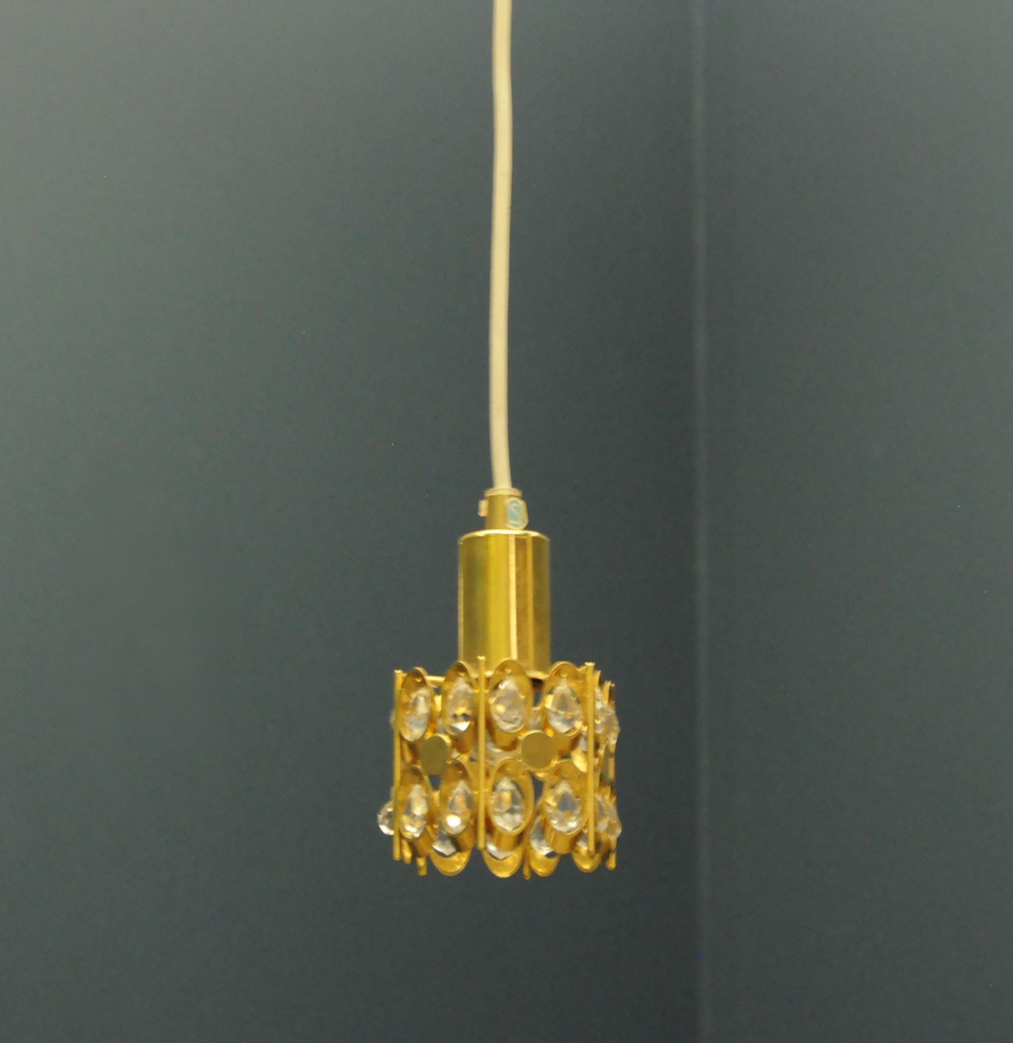 Ceiling lamp in the Hollywood Regency style. Golden.