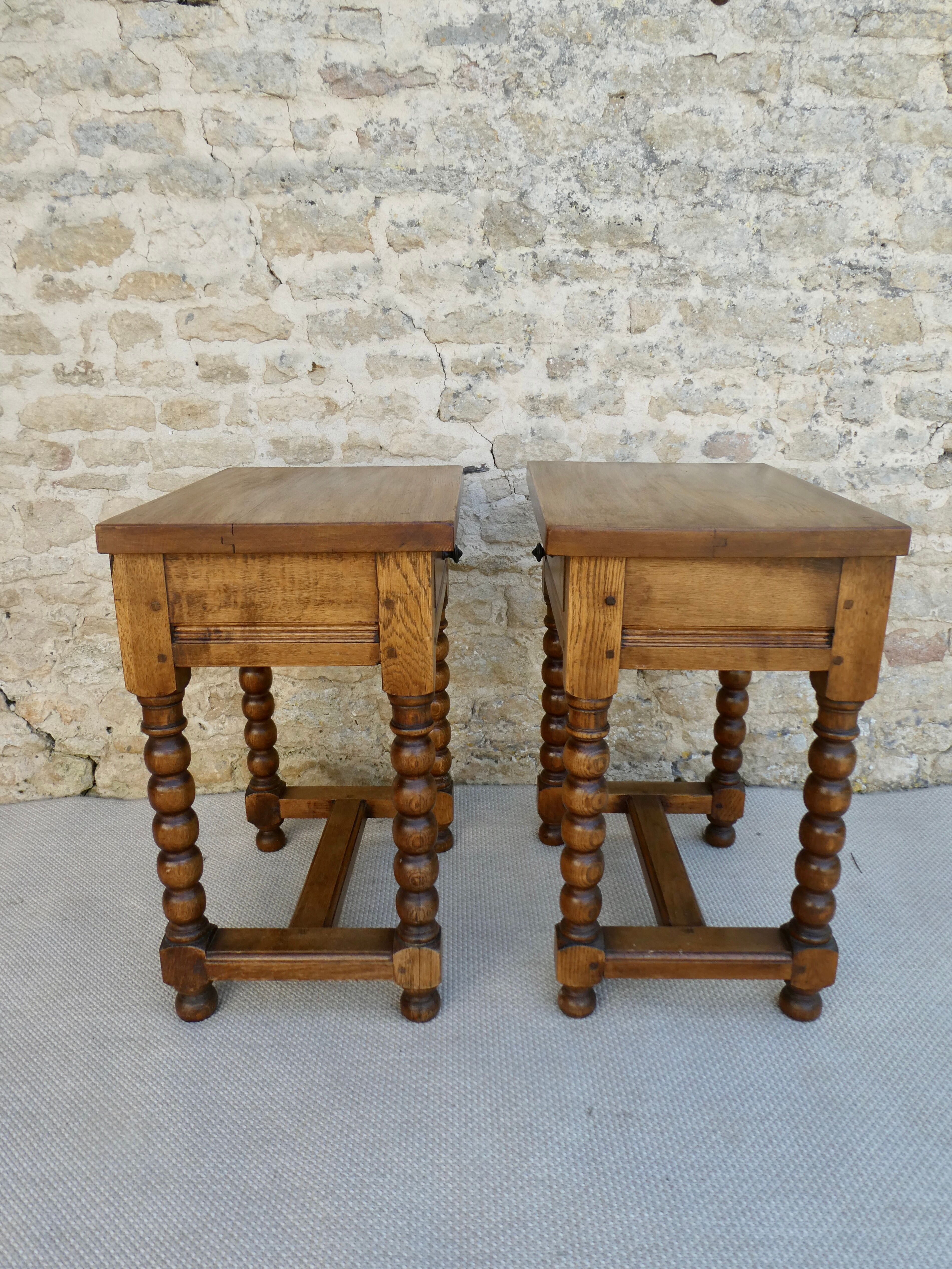 Pair of solid oak bedside tables with carved legs