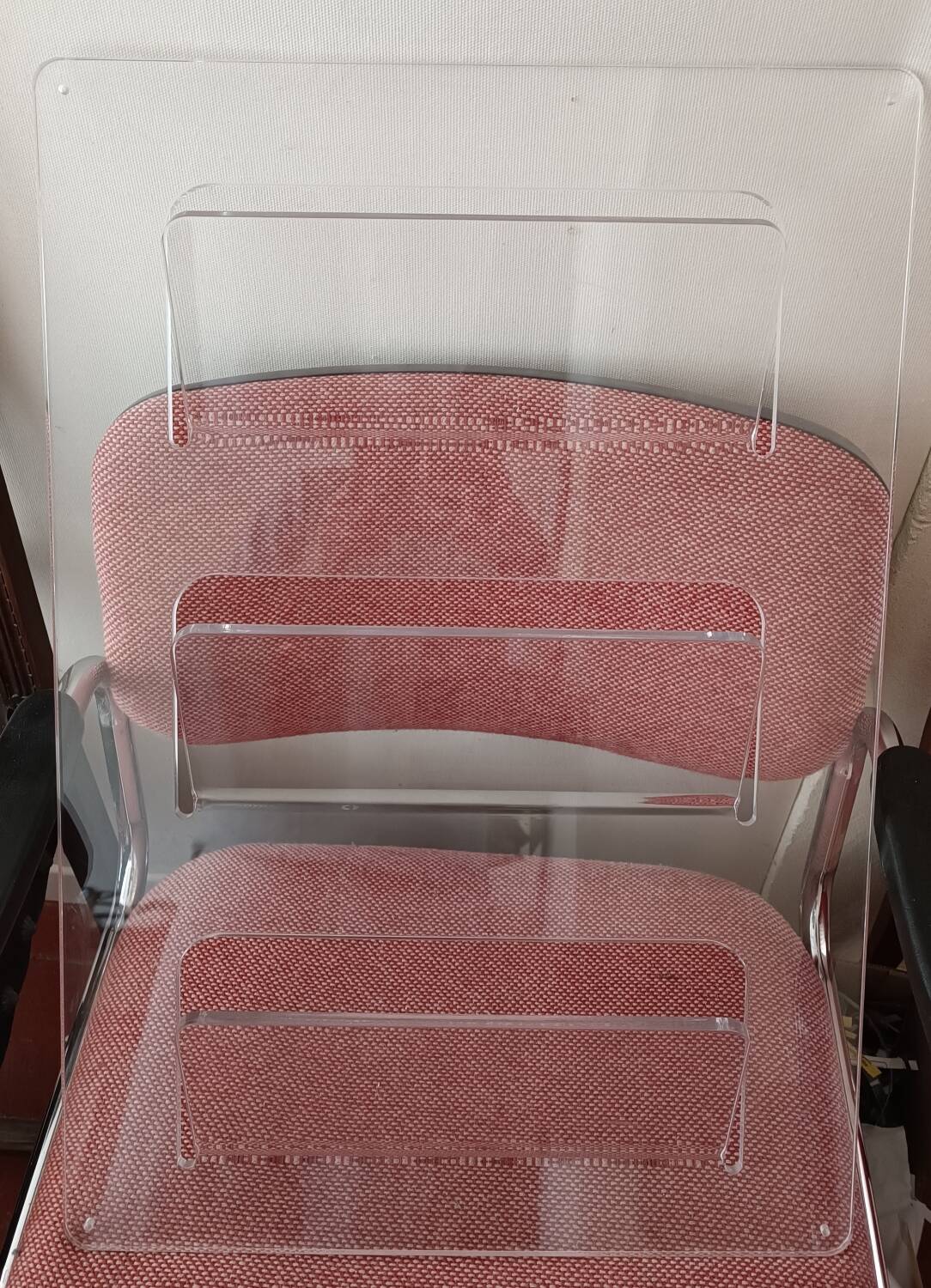 Wall-mounted plexiglass magazine rack