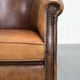 Vintage club chair in sheepskin leather with a characterful look