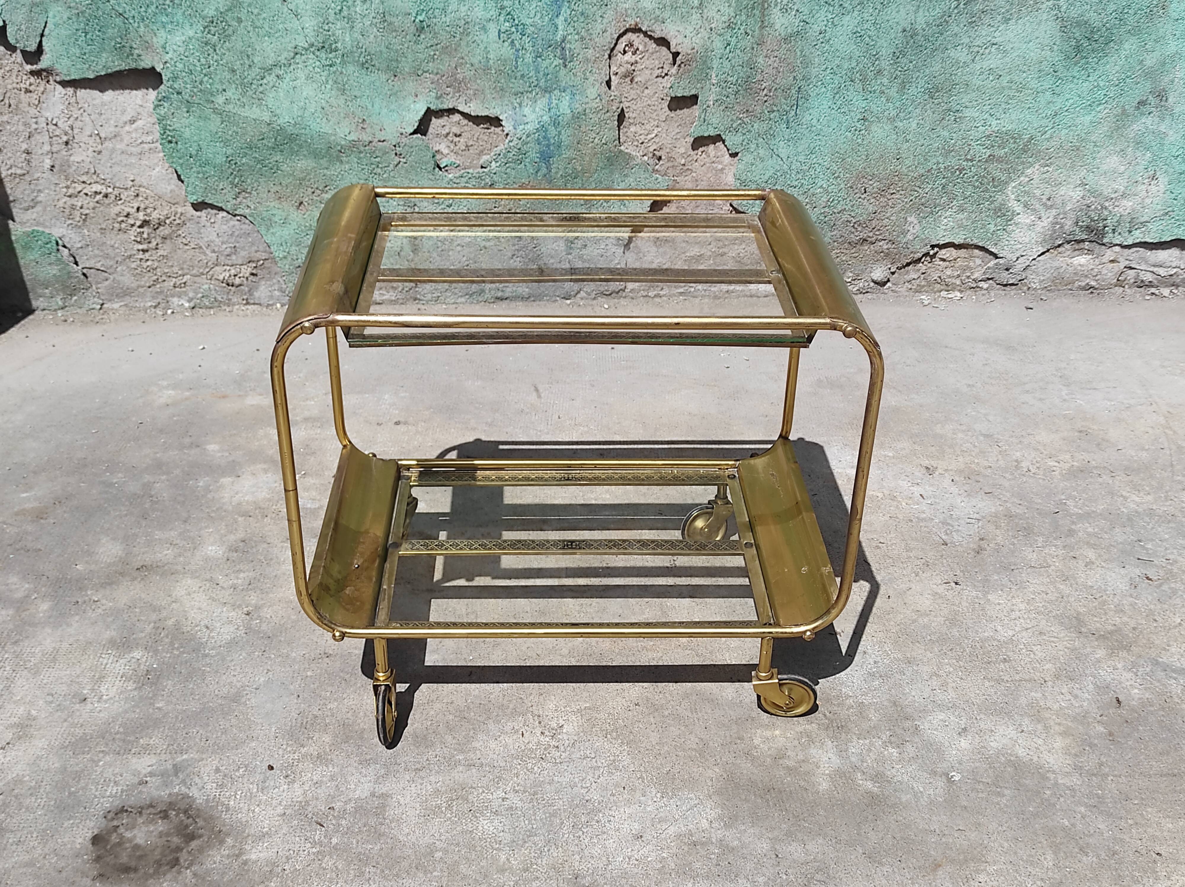 Old rolling coffee table serving vintage brass bar 50s mid-century design