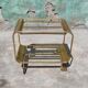 Old rolling coffee table serving vintage brass bar 50s mid-century design