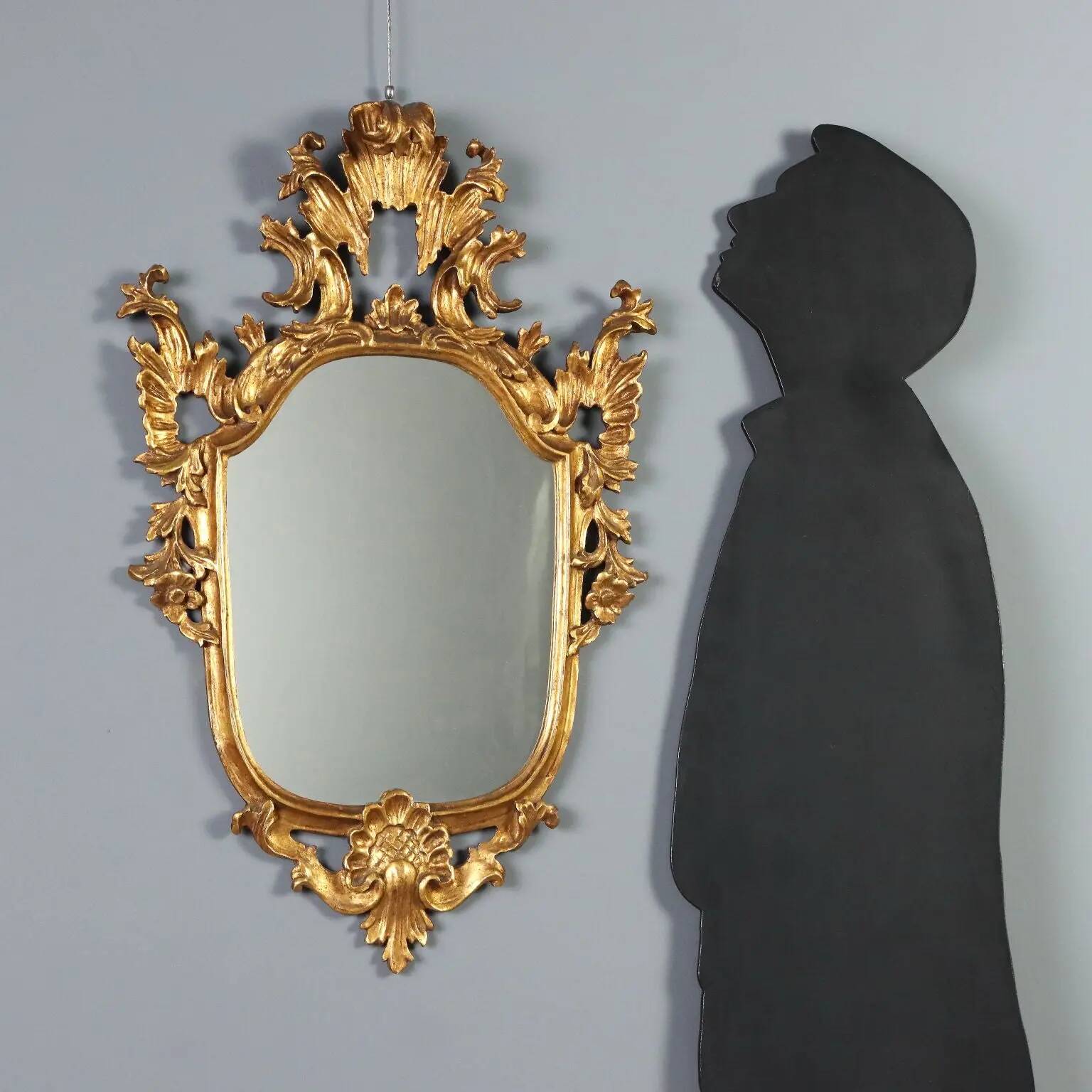 Antique carved and gilded wooden mirror, Italy, late 19th century.