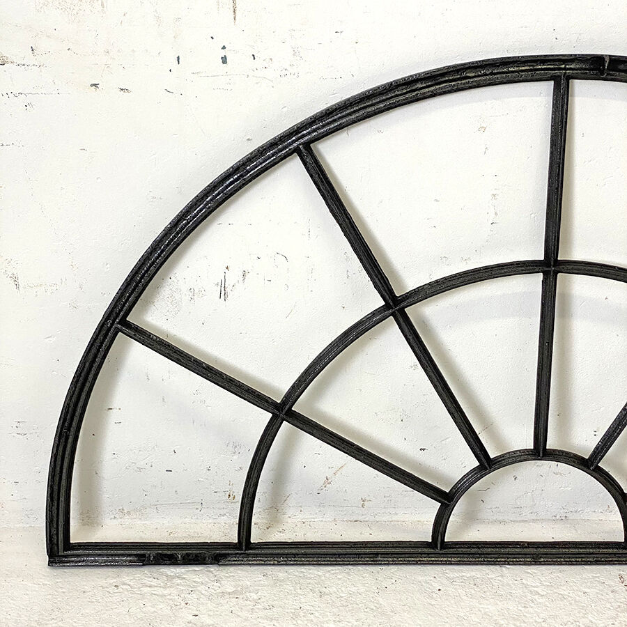 Old arched anthracite grey window