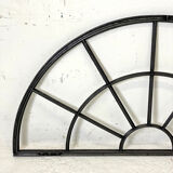 Old arched anthracite grey window