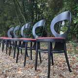 6 vintage Baumann seagull model chairs, black lacquered with red Skai seats.