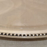 Round serving platter in silver-plated metal