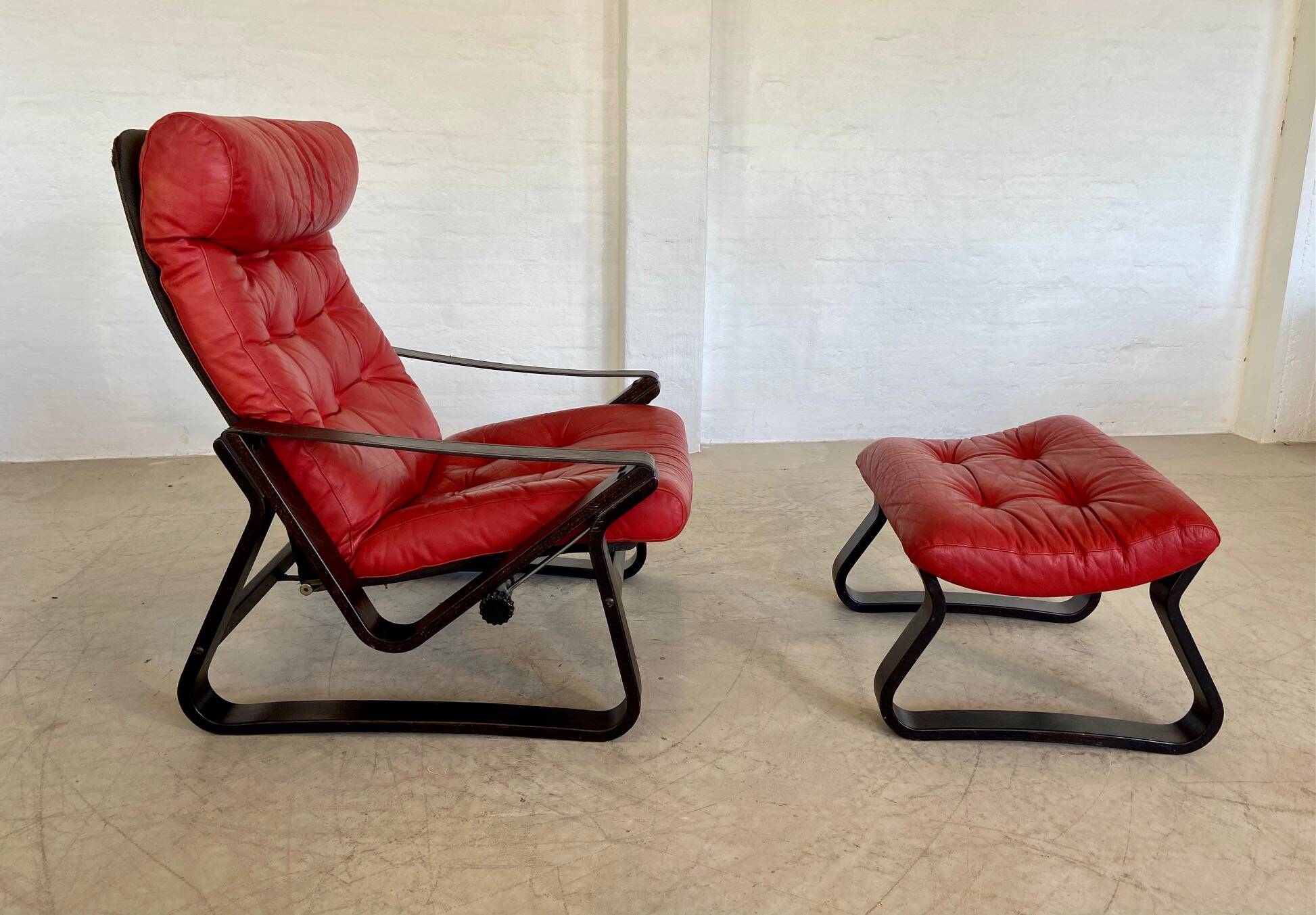 Vintage danish retro reclining lounge chair & stool in red leather by komfo
