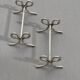 Set of six silver-plated ribbon-shaped knife rests. 20th century