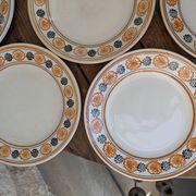 10 dessert plates Saint Amand Amandinoise frilled with orange and black flowers.