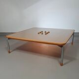 Rare coffee table 110 x 110 x height 35 cm with 8 flange wooden / cork caps in the glass top.