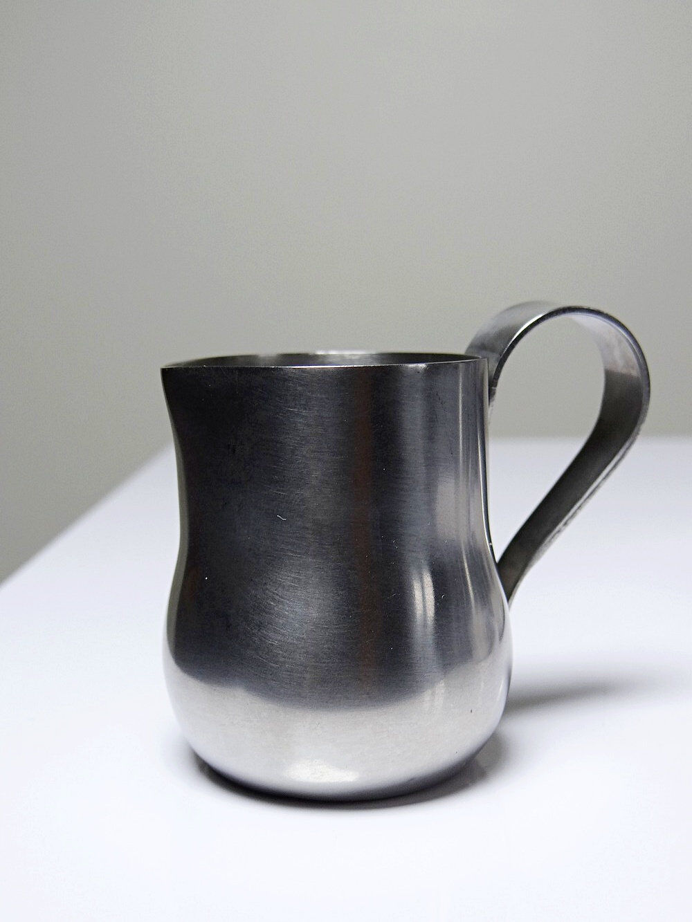 Set of 4 vintage bar measures in brushed stainless steel from the 60s-70s.