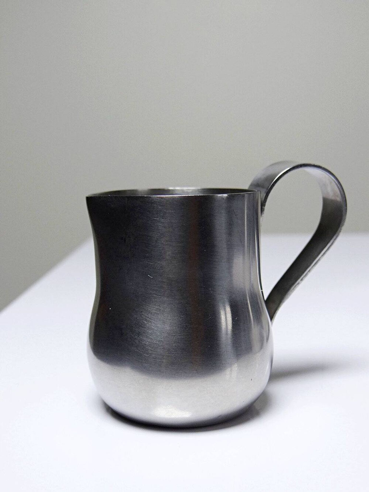 Set of 4 vintage bar measures in brushed stainless steel from the 60s-70s.