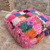 Berber floor pouf: Handwoven Moroccan wool cushion.