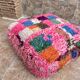 Berber floor pouf: Handwoven Moroccan wool cushion.