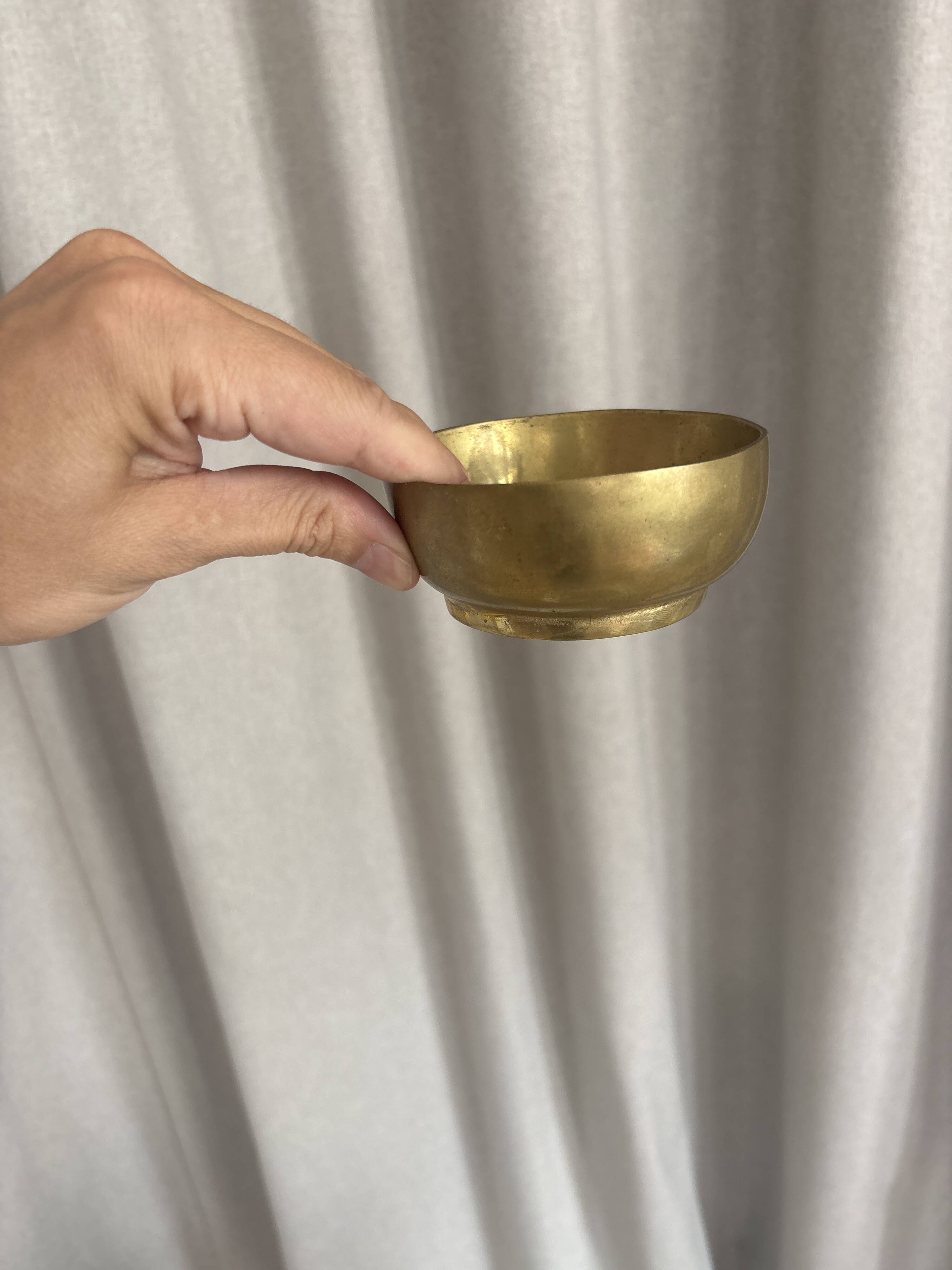 Empty pocket ensemble and bowl in solid brass signed Giò Lanciani.