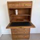 Vintage wooden secretary desk in the style of a professional piece of furniture