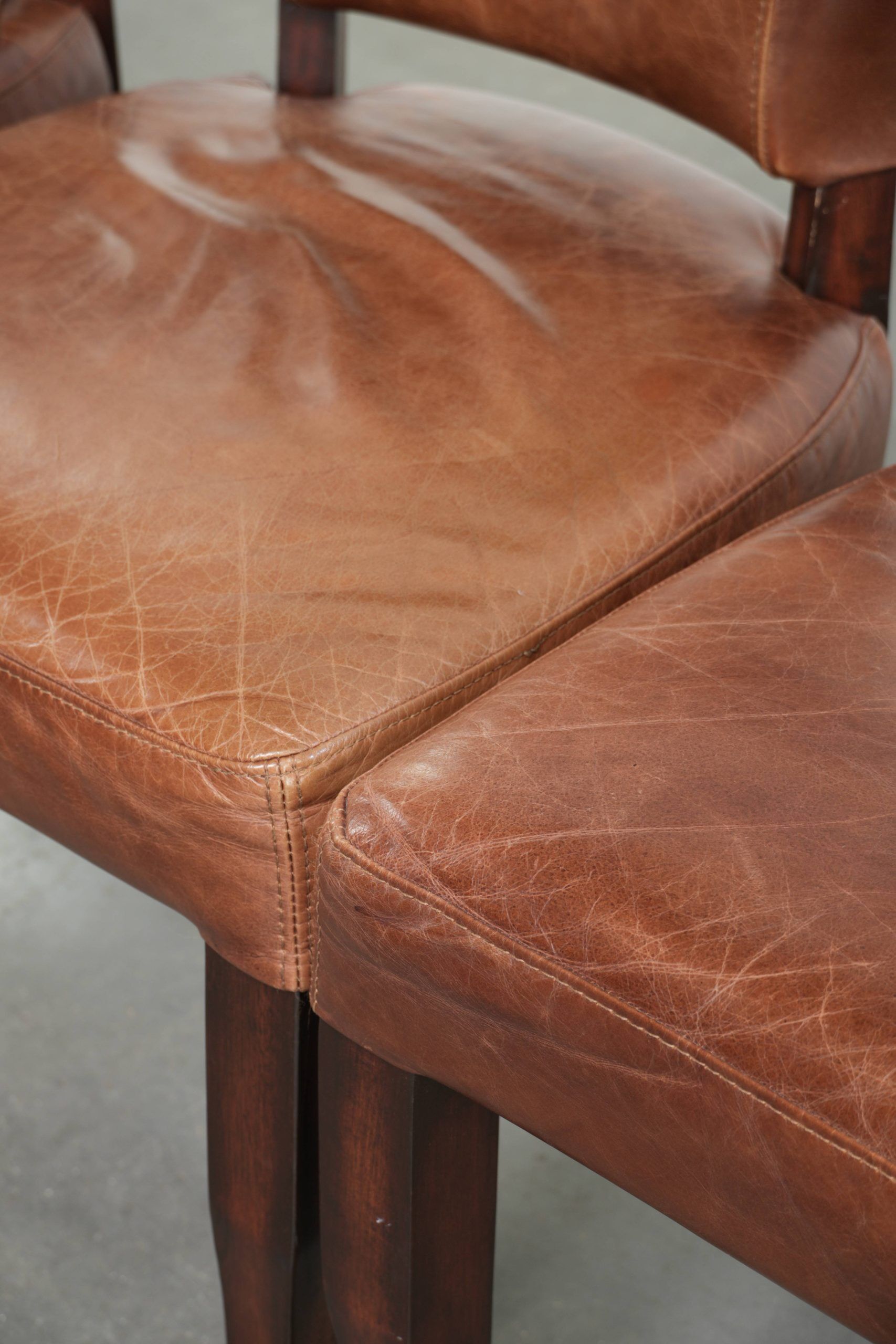 Set of 4 cognac-coloured cowleather dining chairs with decorative nails