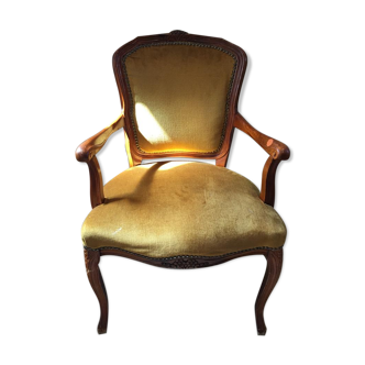 Yellow velvet armchair