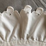 Two half-moon ruffled cushion covers