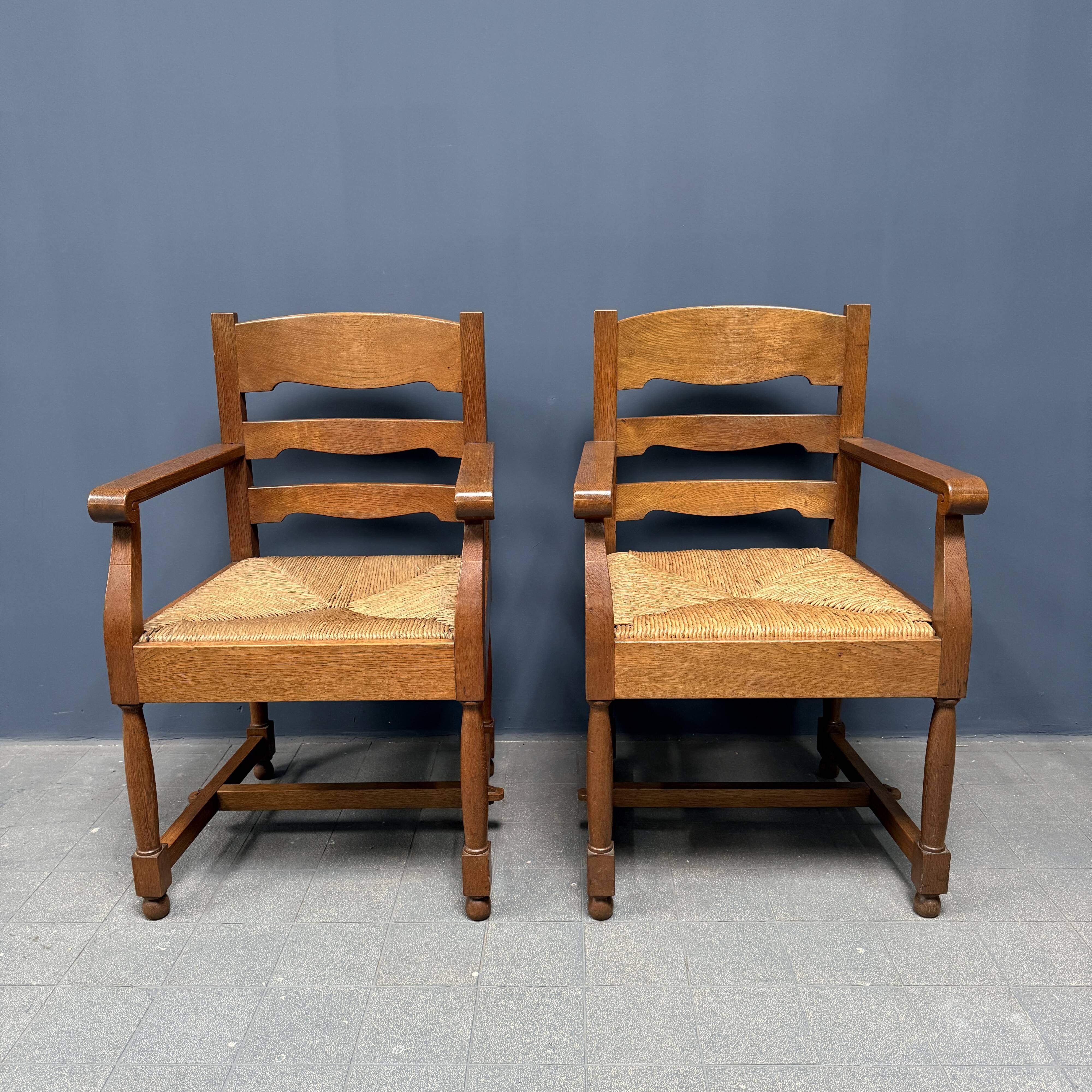 Set of two Dutch oak armchairs with rush seats