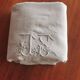 Antique embroidered linen sheet with a monogram.