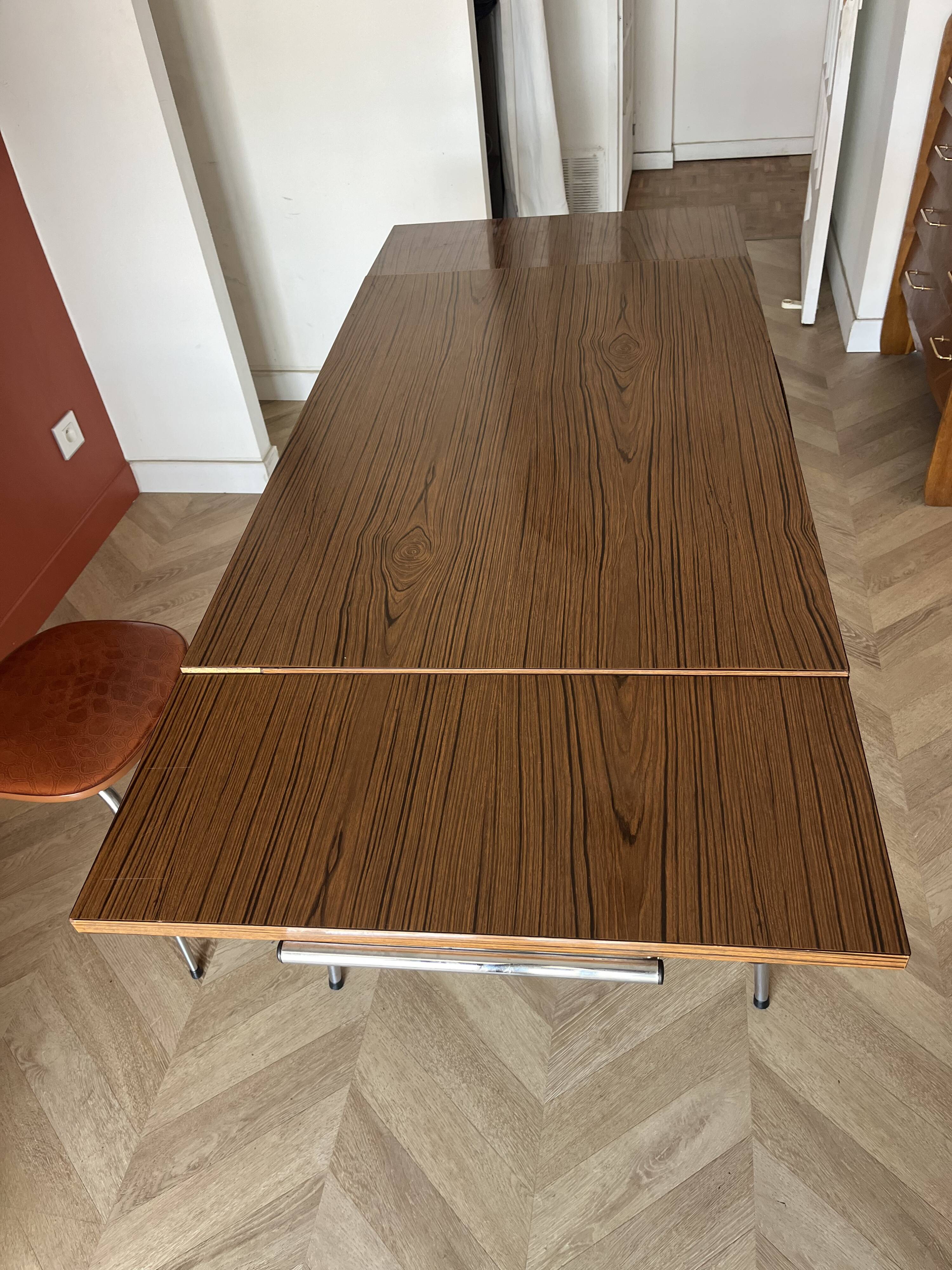 Vintage extendable kitchen table with wood effect Formica and chrome legs.