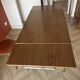Vintage extendable kitchen table with wood effect Formica and chrome legs.
