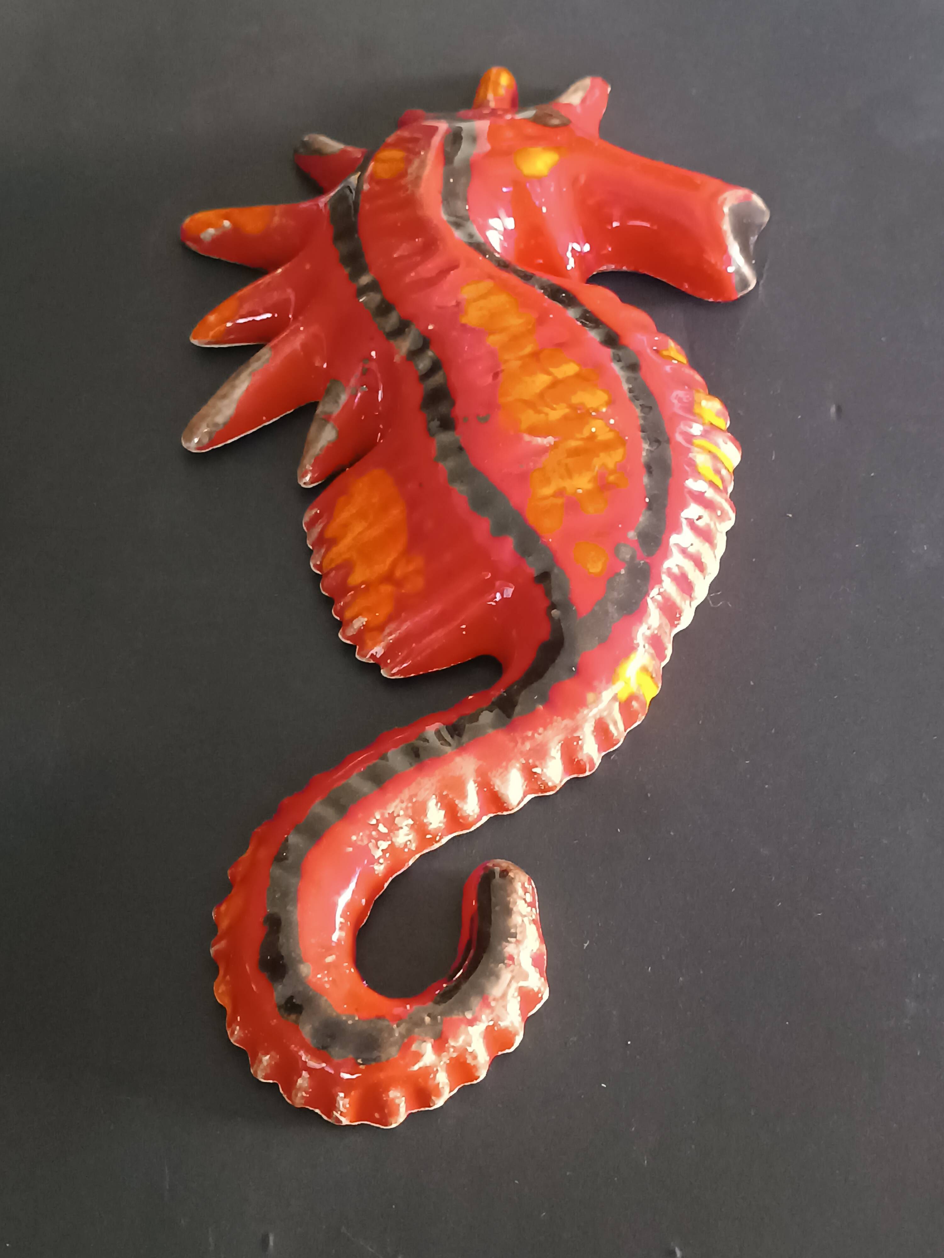 Two vintage ceramic wall pots featuring a seahorse and a starfish.