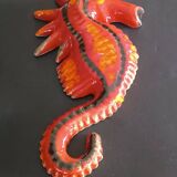 Two vintage ceramic wall pots featuring a seahorse and a starfish.