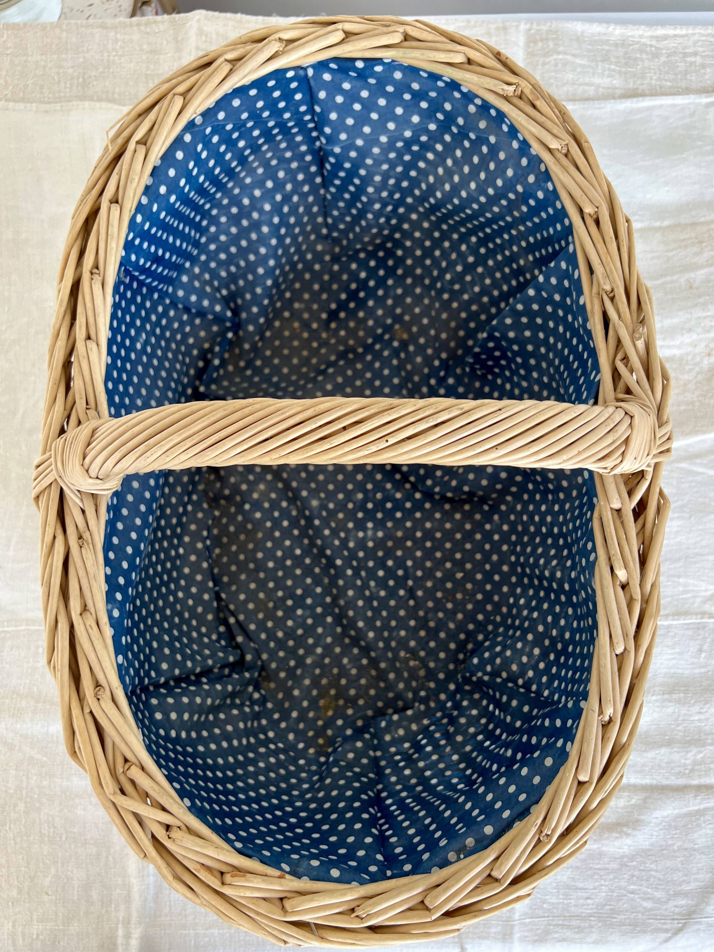 Large vintage wicker basket and blue lining with white polka dots